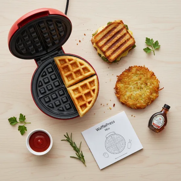 Various small foods like waffles, paninis, and hash browns made in a mini waffle maker.